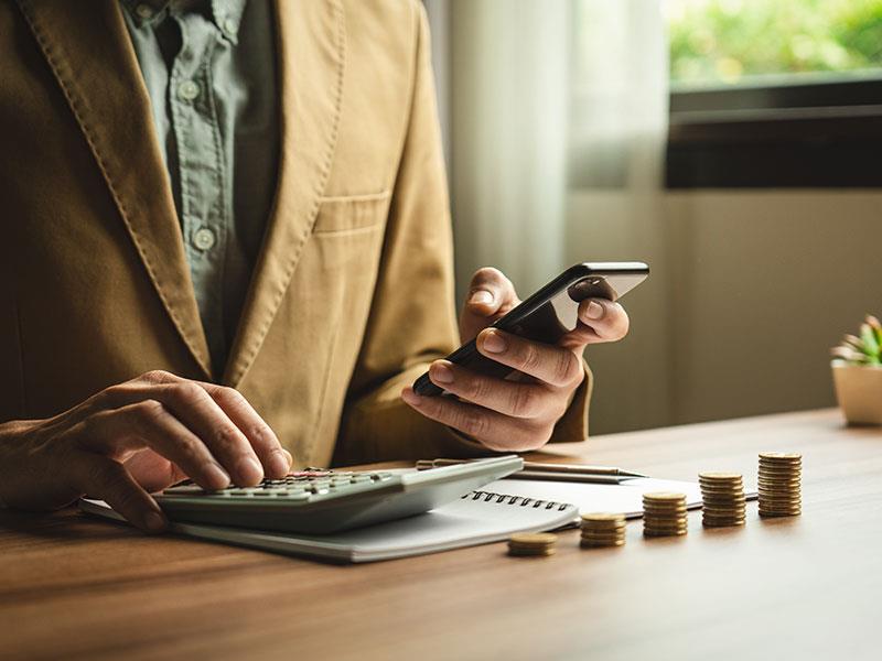 Private Equity manager working with a calculator